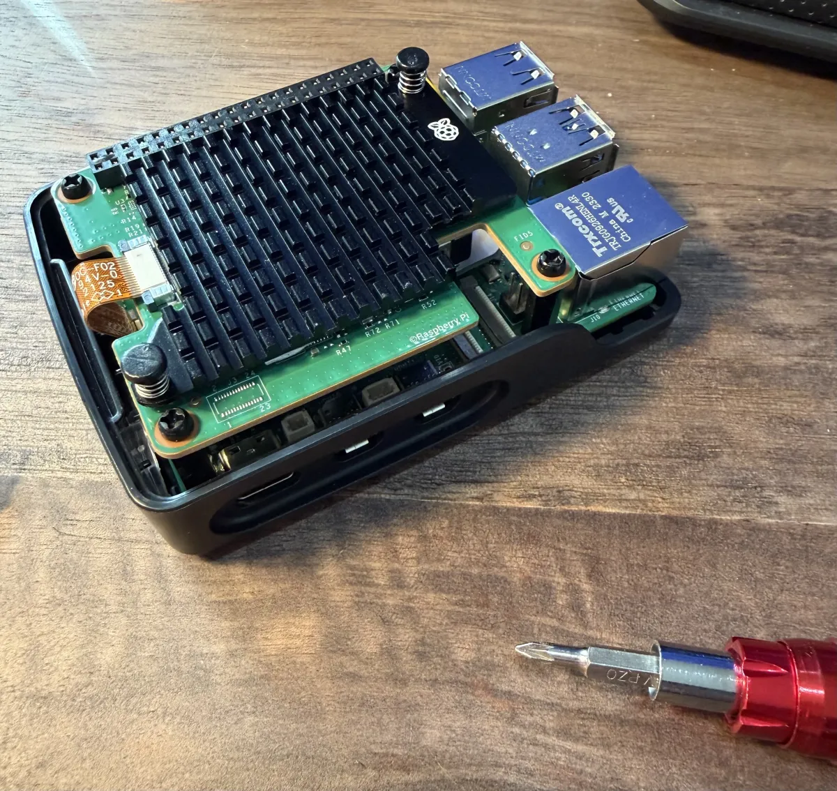 Raspberry Pi 5 with AI HAT+ installed in a case